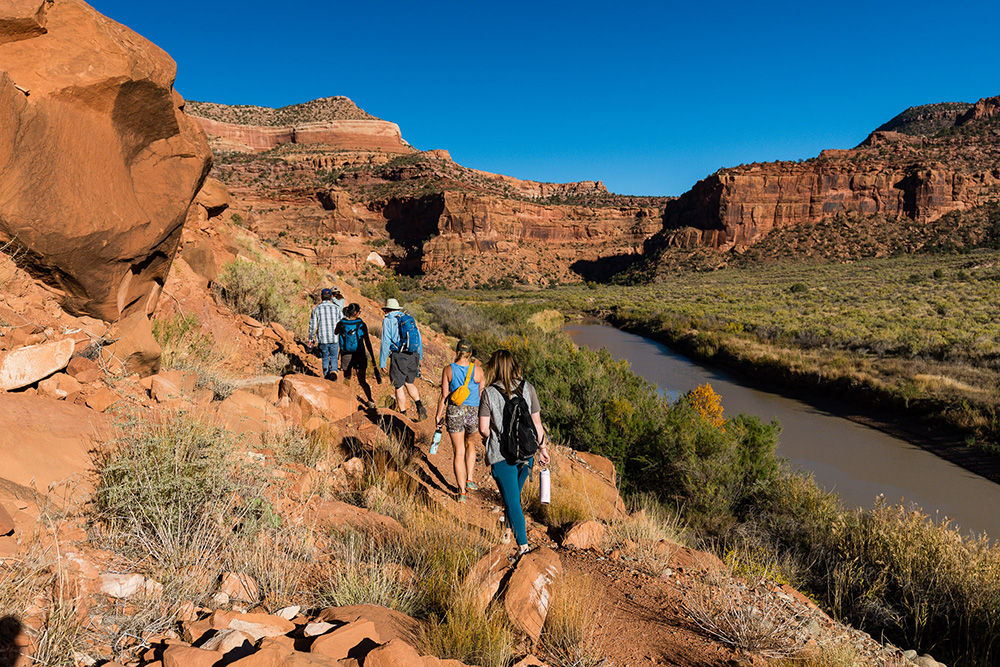 TCA staff and members hike through the Dolores River Canyon Country during Advocate Outdoors event